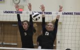 Dulaney Jones and Bailey Kerby guard the net against Tulare Union.
